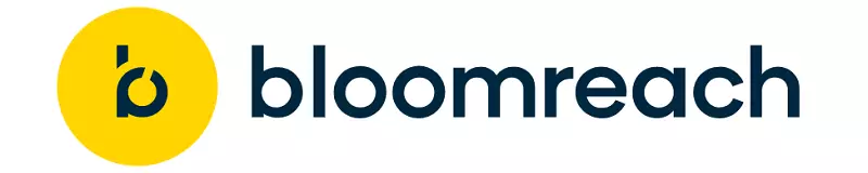Logo Bloomreach terletak di latar belakang putih, menampilkan huruf "b" bergaya modern dalam bentuk melingkar berwarna kuning, diikuti teks "loomreach" berwarna biru tua. Desain sederhana dan profesional mencerminkan identitas merek.