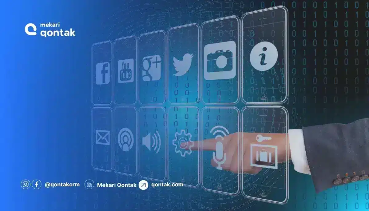 Jari menyentuh ikon di layar digital yang menampilkan berbagai aplikasi sosial media, dalam suasana teknologi modern berwarna biru.
