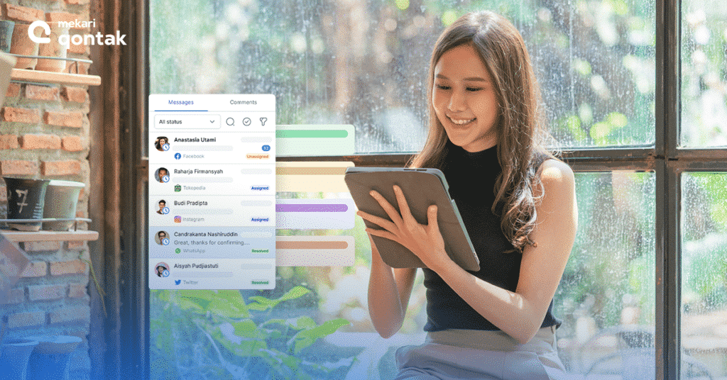 1. Marketing Automation Seorang pengguna memegang tablet sambil melihat antarmuka aplikasi pesan, dikelilingi oleh suasana alami dan jendela besar yang terbuka.