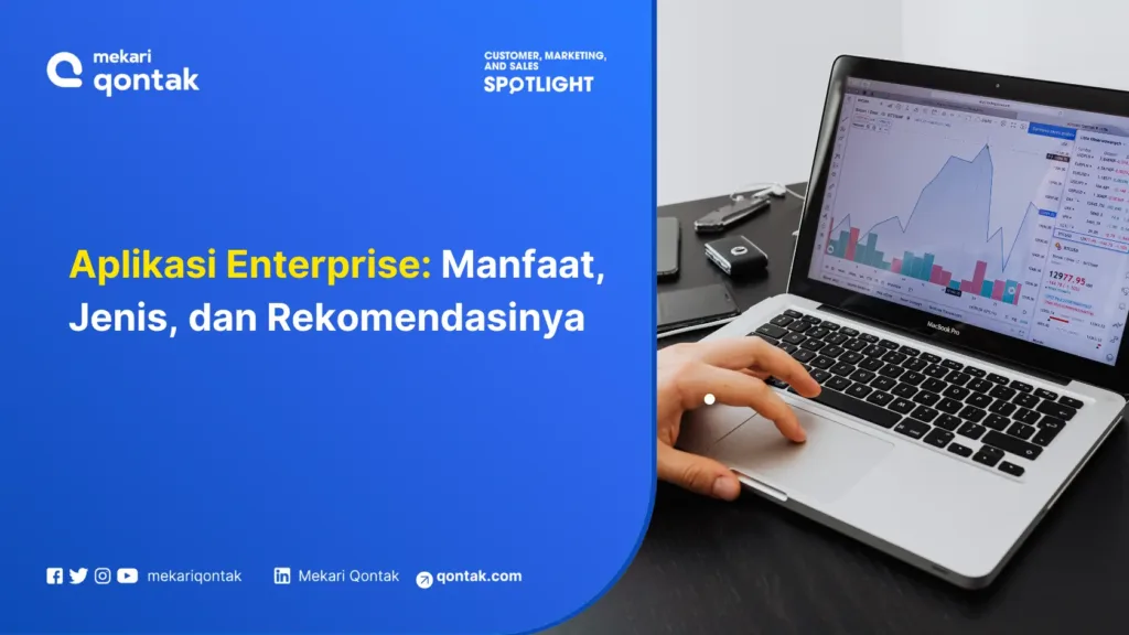 Ilustrasi Aplikasi Enterprise Manfaat, Jenis, dan Rekomendasinya Laptop menampilkan grafik dan data analisis pasar, sementara tangan pengguna sedang mengoperasikannya pada meja kerja yang rapi.