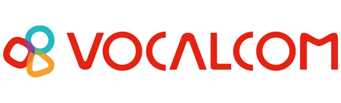 Logo bertuliskan "VOCALCOM" dengan elemen warna-warni yang menyertainya, menciptakan kesan modern dan dinamis dalam konteks teknologi dan komunikasi.